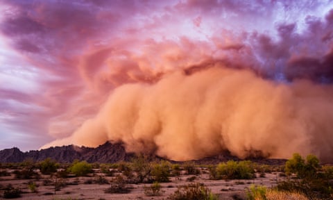 A dust storm at sunset in the Arizona desert.