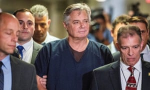 Former Trump campaign chairman Paul Manafort is escorted into court for his arraignment in New York, in June.