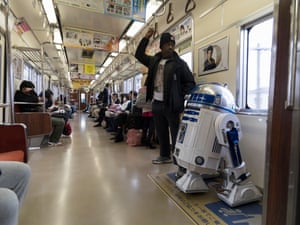 Richard and R2-J1 take the train together