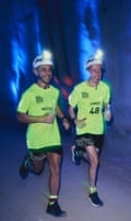 Runners James and Michael taking part in the world’s deepest marathon, running with head torches on
