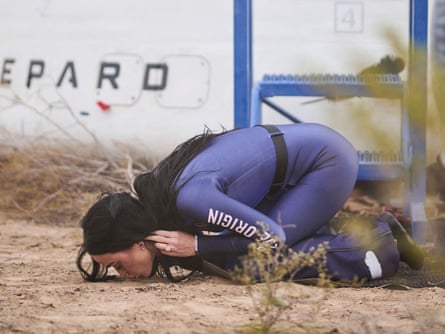 Katy Perry kissing the ground.