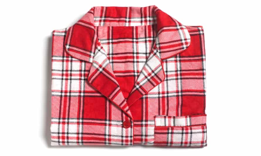 A pyjama shirt, neatly folded