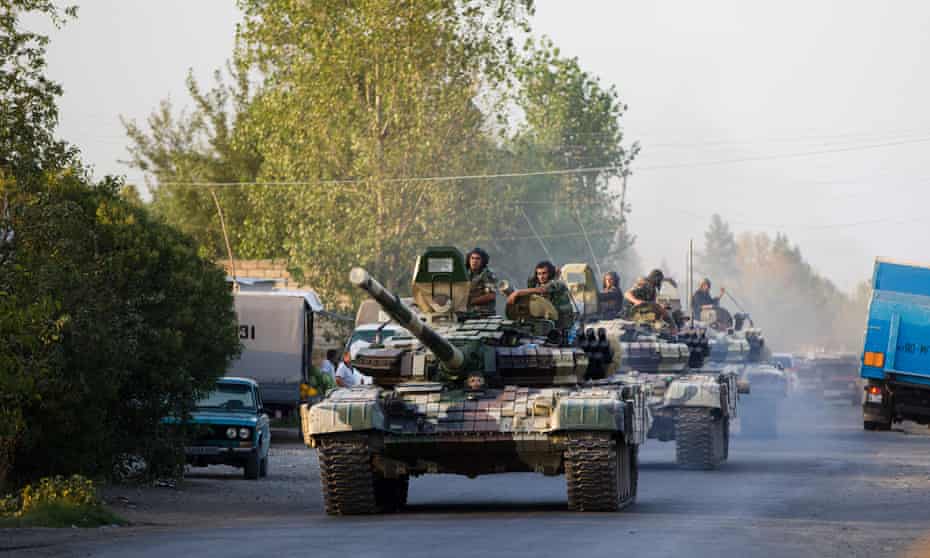 A convoy of Azerbaijan’s tanks moves in the direction of Agdam, in 2014, after a sharp escalation in fighting between Azerbaijan and Armenia around a tense line of control around Nagorno-Karabakh. Photograph: Abbas Atilay /AP