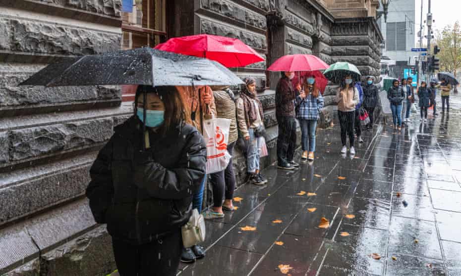 International students lined up outside the Melbourne Town Hall in June, as the City of Melbourne distributed retail vouchers to support students impacted by Covid.