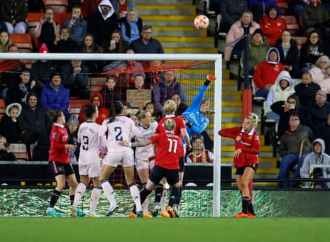 Manchester United keeper Mary Earps punches the ball clear during the FA Women’s Super League game against Arsenal.