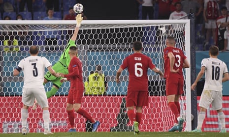 Turkey’s goalkeeper Ugurcan Cakir makes a save from Italy’s Giorgio Chiellini,
