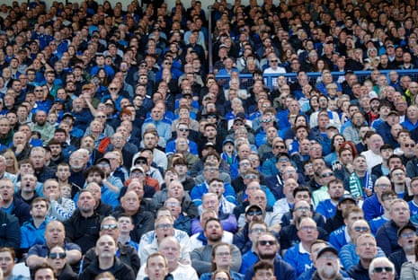 Everton fans in the Park End watch the action