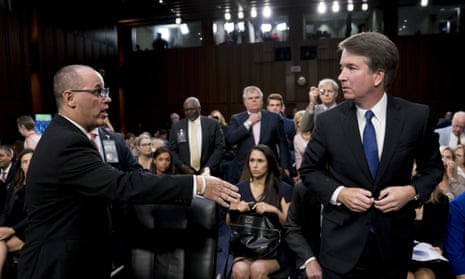 Brett Kavanaugh, Fred Guttenberg<br>Fred Guttenberg, the father of Jamie Guttenberg who was killed in the Stoneman Douglas High School shooting in Parkland, Fla., left, attempts to shake hands with President Donald Trump's Supreme Court nominee, Brett Kavanaugh, right, as he leaves for a lunch break while appearing before the Senate Judiciary Committee on Capitol Hill in Washington, Tuesday, Sept. 4, 2018, to begin his confirmation to replace retired Justice Anthony Kennedy. Kavanaugh did not shake his hand. (AP Photo/Andrew Harnik)