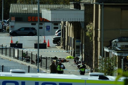 Railway station in Huntingdon with police tape and officers standing at scene