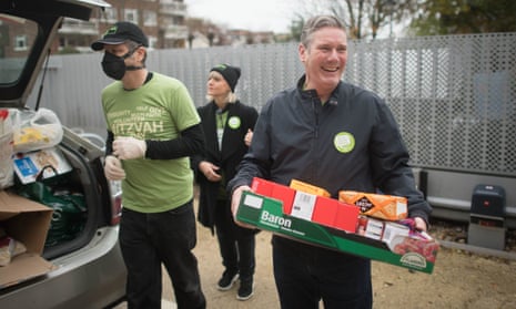 Keir Starmer helps with distributing food parcels at South Hampstead Synagogue, north London, 15 November.
