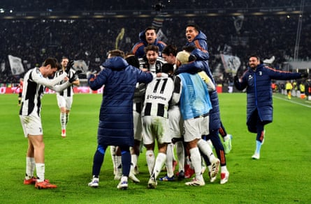 Juventus's Timothy Weah is surrounded by his teammates after scoring their second goal