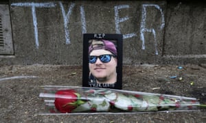 A makeshift memorial dedicated to Tyler Gerth, a photographer who was shot and killed at a protest in Louisville.