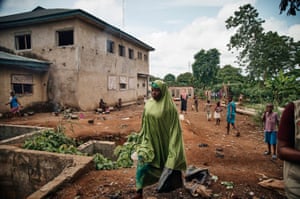 A woman walking through grounds