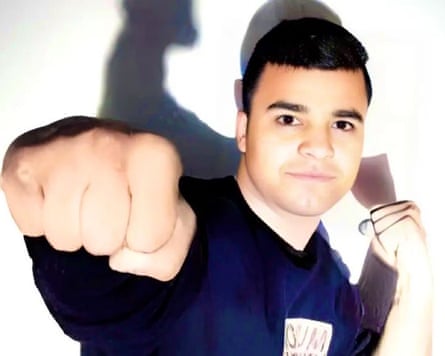 Boxer Mohammad Javad Vafaei Sani punches towards the camera, his shadow visible behind him