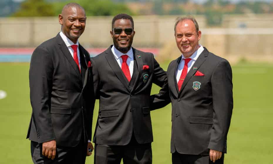 Malawi’s manager Mario Marinica (right) with the FA president Walter Nyamilandu (left) and executive committee member Chimango Munthali.