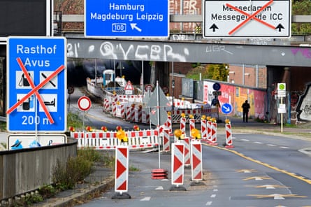 Crossed out road signs and traffic cones on a motorway in Berlin.