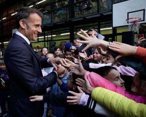 France's President and Co-Prince of Andorra Emmanuel Macron meets with students at a school in Santa Coloma, on the second day of his visit to the microstate of Andorra.
