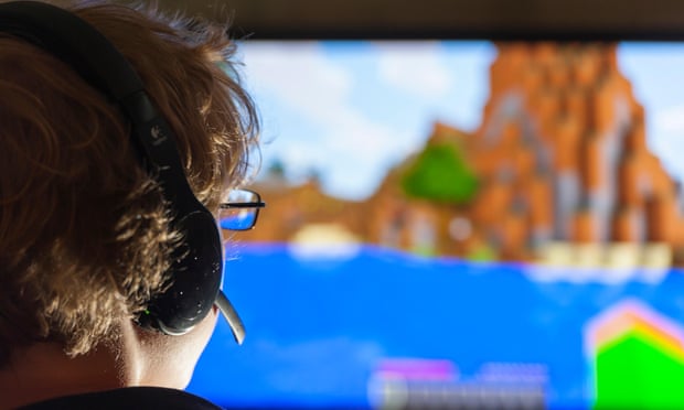 A boy plays Minecraft, developed by Swedish company Mojang.