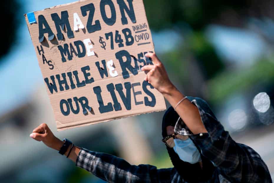 Workers protest against the failure from their employers to provide adequate protections in the workplace of the Amazon delivery hub in Hawthorne, California, on 1 May.