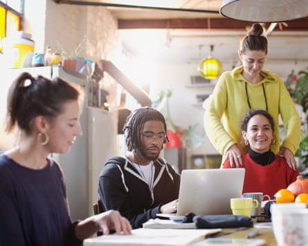 Young people at the kitchen table in an apartment