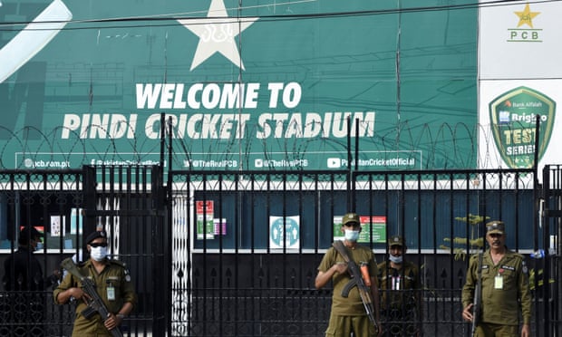 Police officers stand guard outside Rawalpindi Cricket Stadium after New Zealand pulled out of their tour.