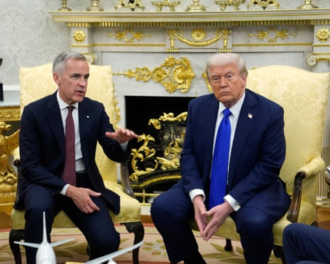 Two men in suits sit at adjacent yellow brocade chairs in a gilded room.