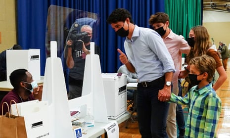 Liberal leader Justin Trudeau votes with the help of his children, clockwise from top, Xavier, Ella-Grace and Hadrien, in his riding of Papineau, Montreal, Quebec.