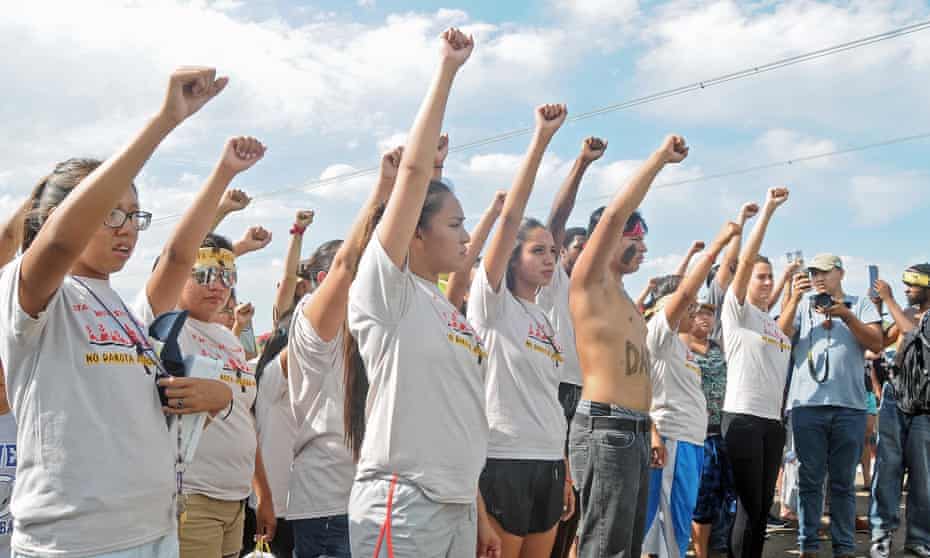 People against the Dakota Access pipeline chant in opposition on Thursday, Aug. 11, 2016, at a site where a roadway was being constructed to begin the process of building the pipeline.