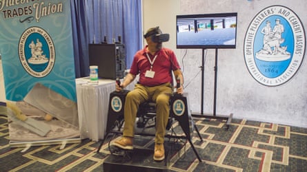 Man in conference hall wearing VR headset.