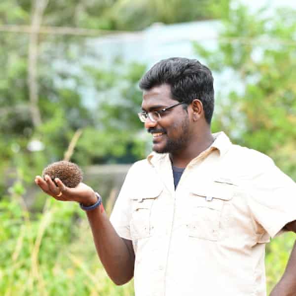 Brawin Kumar holding a hedgehog. He came up with the idea for the comic book when he realised how few children knew anything about the nocturnal animal.