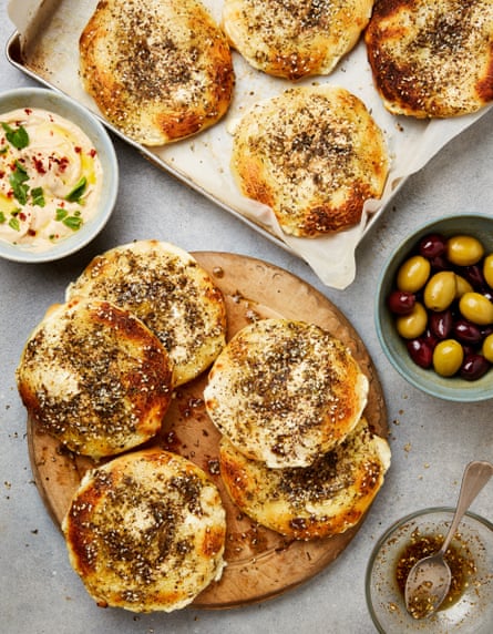 Yotam Ottolenghi’s manakish – savoury levantine flatbreads with labneh on top, hummus on the side and some olives.