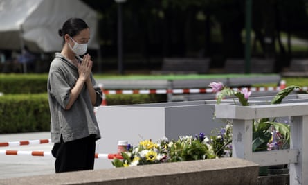 A woman prays in front of the cenotaph for the atomic bombing victims in Hiroshima on Monday.
