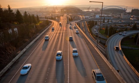 view of cars on freeway in seattle at sunset