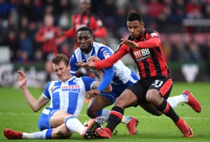 Dan Burn, left, and Cheyenne Dunkley of Wigan Athletic combine to thwart Bournemouth’s Lys Mousset during their 2-2 draw at the Vitality Stadium