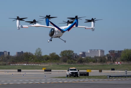 an electric helicopter taxi in the air