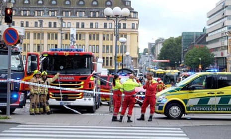 Police and rescuers at the scene in Turku after multiple stabbings. 
