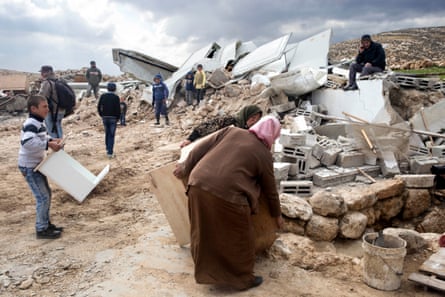 Villagers in Khirbet Jenbah rescue furniture following house demolitions by the Israeli military
