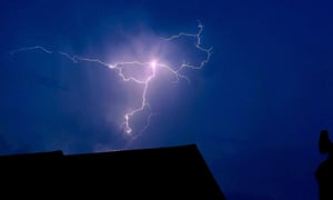 Lightning over the top of houses in St Albans on Sunday.