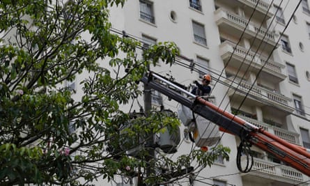 A Sao Paulo technician works on an electrical post during a 30-hour power outage in the Pinheiros neighbourhood.