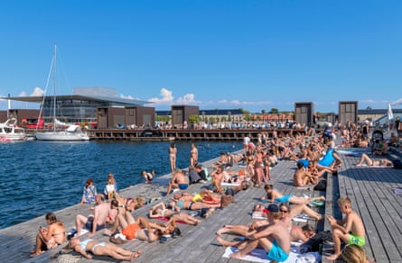 people sunbathing on a deck