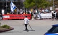 Protesters demand Google end cloud contract with Israel<br>A counter-protester holding an Israeli flag walks into the parking lot near a protest at Google Cloud offices in Sunnyvale, California, U.S. on April 16, 2024. REUTERS/Nathan Frandino
