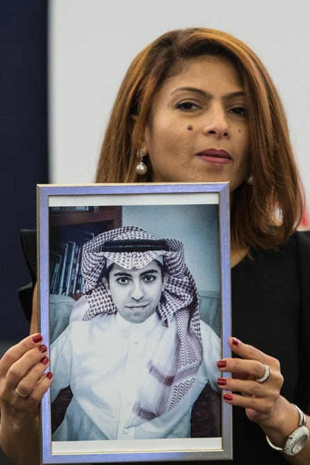 Ensaf Haidar, wife of jailed Saudi blogger Raif Badawi, holds a picture of her husband in the European parliament in Strasbourg, France.