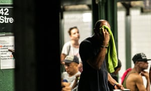 Passengers on a New York subway platform suffer during July’s heatwave.
