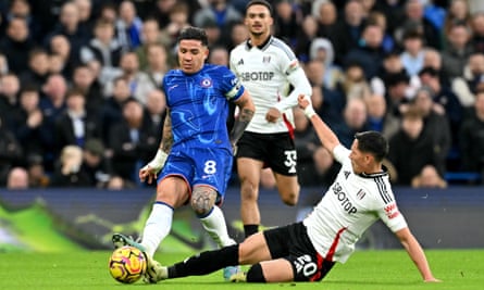 Sasa Lukic slides in to challenge Chelsea’s Enzo Fernandez during Fulham’s victory at Stamford Bridge in December.
