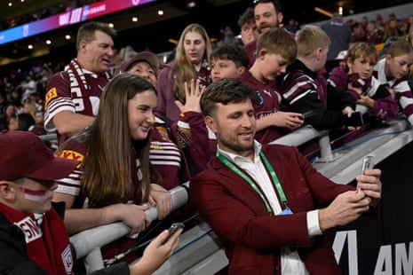 Jai Arrow takes selfies with fans at Suncorp Stadium.