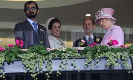 Queen Elizabeth II, Prince Edward, Earl of Wessex, (2R) greet Emir of Dubai Sheikh Mohammed bin Rashid al-Maktoum (L) and his wife Jordan’s Princess Haya bint al-Hussein on the second day of the Royal Ascot horse racing meet in Ascot, 2016