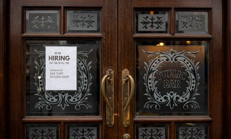 A help wanted sign on a pub door in London.