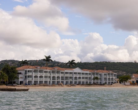 A beachfront resort under construction on Jamaica’s north coast, with hills behind