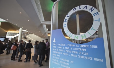 Participants gather during a break at the One Planet Summit, in Boulogne-Billancourt near Paris, France