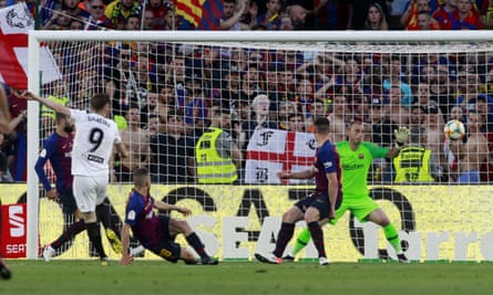 Kevin Gameiro (left) scores Valencia’s opening goal against Barcelona.